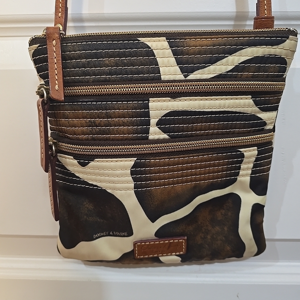 Dooney & Bourke Giraffe Print Triple Zip Nylon Crossbody Bag.